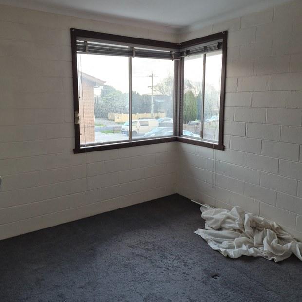 Bedroom before end of lease cleaning, curtains on the floor, Clayton South