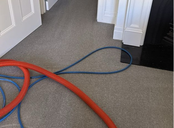 Steam cleaning equipment set up in a Malvern period home hallway