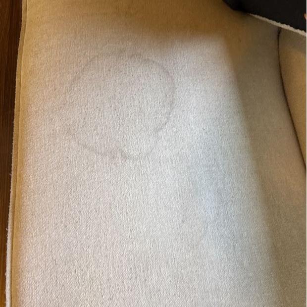 Chaise cushion with ring stain before steam cleaning, second angle