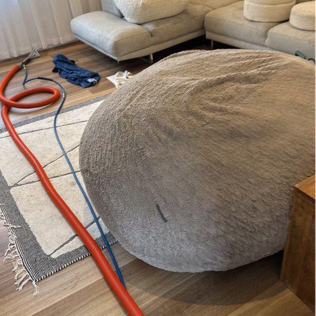Upholstery cleaning in progress — couch, pouf and bean bag