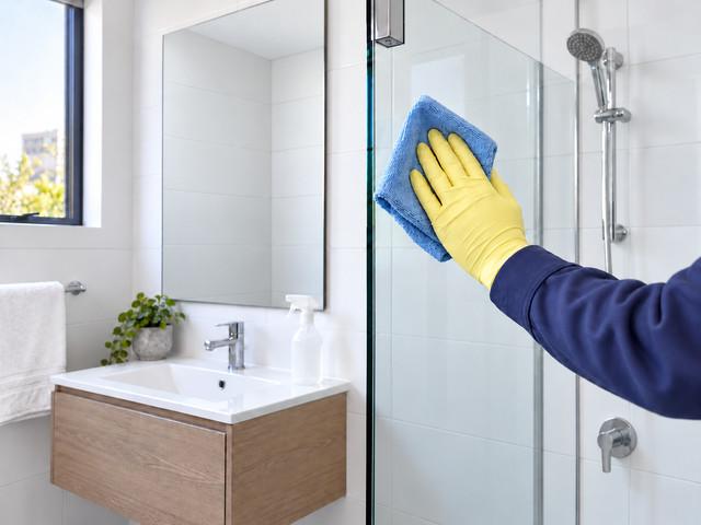 Glass shower screen and vanity wiped clean during a regular house clean