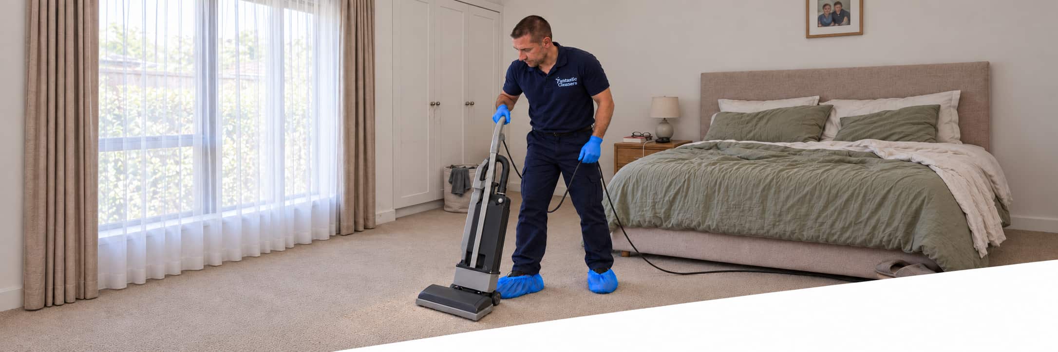 carpet-dry-cleaning-melbourne-d Fantastic Cleaners technician dry cleaning a bedroom carpet in Melbourne